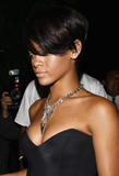 Rihanna leggy and cleavagy in small black dress in West Hollywood